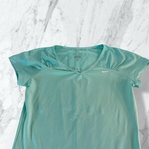 Nike Dri-FIT short-sleeve V-neck athletic T-shirt in a mint green color. Size M